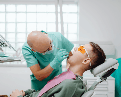 Dentist whitening teeth