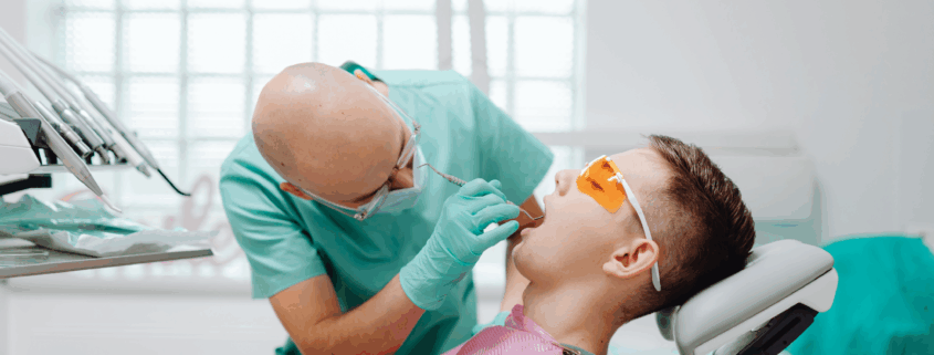 Dentist whitening teeth